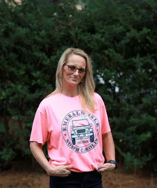 Mobility Concepts crew member in a pink T-shirt