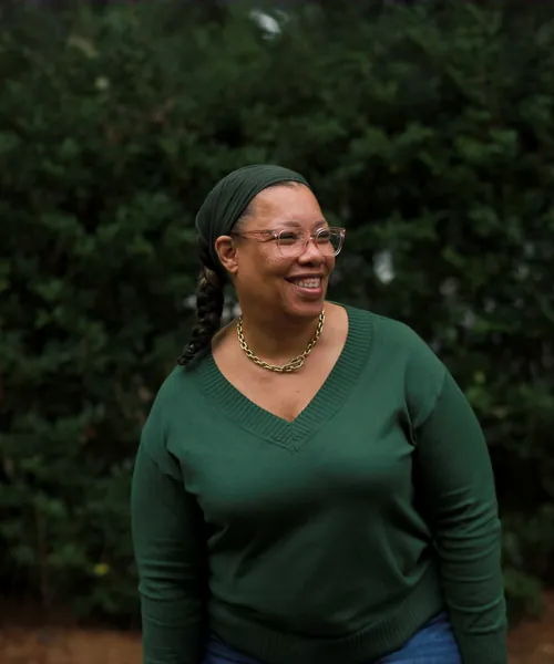 Mobility Concepts crew member in a green sweater