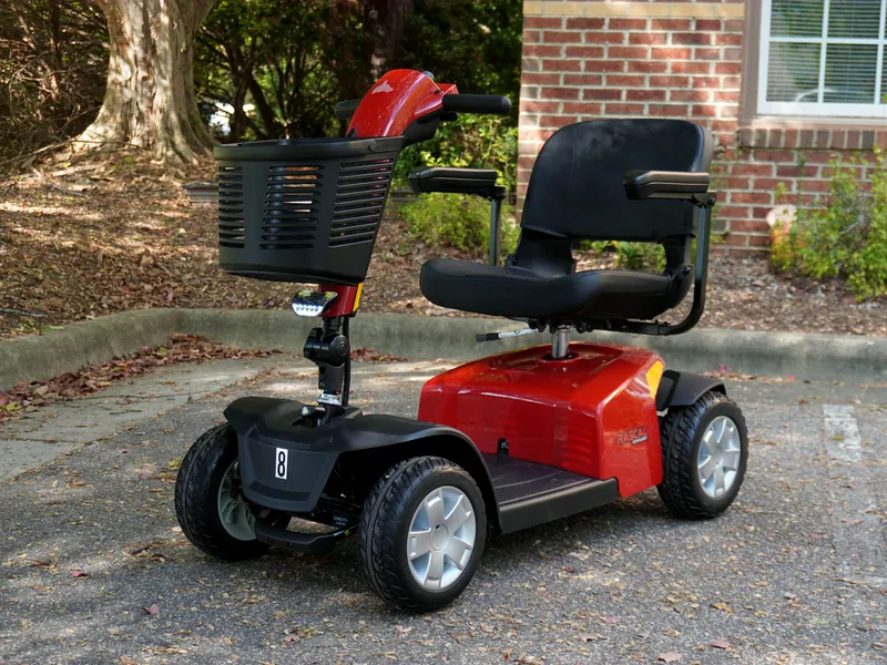 Red four-wheel mobility scooter with a front basket